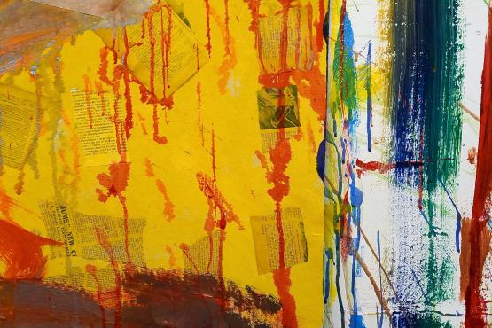 An abstract painting with a yellow background and red brush marks. Scraps of newspaper can be seen underneath the yellow paint.