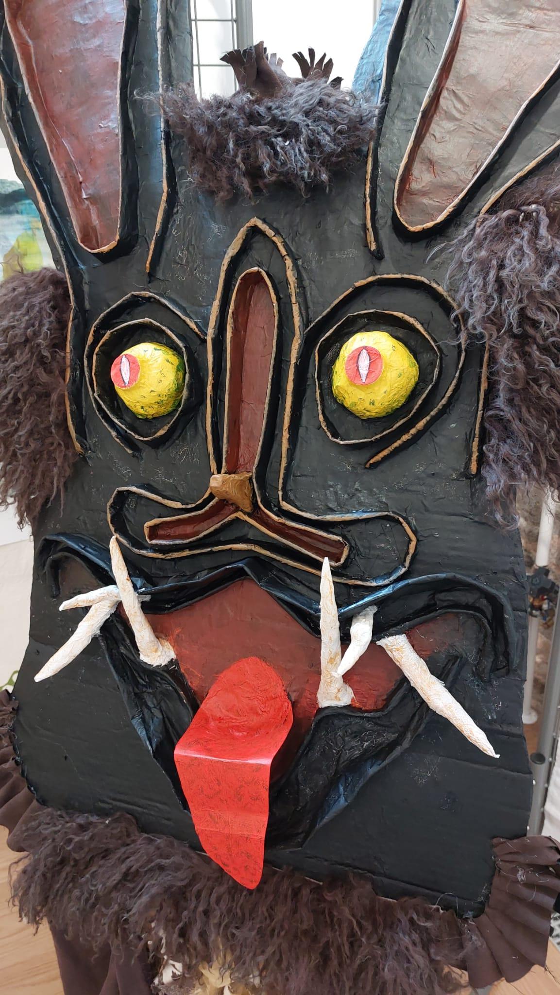 large bat mask with red tongue sticking out