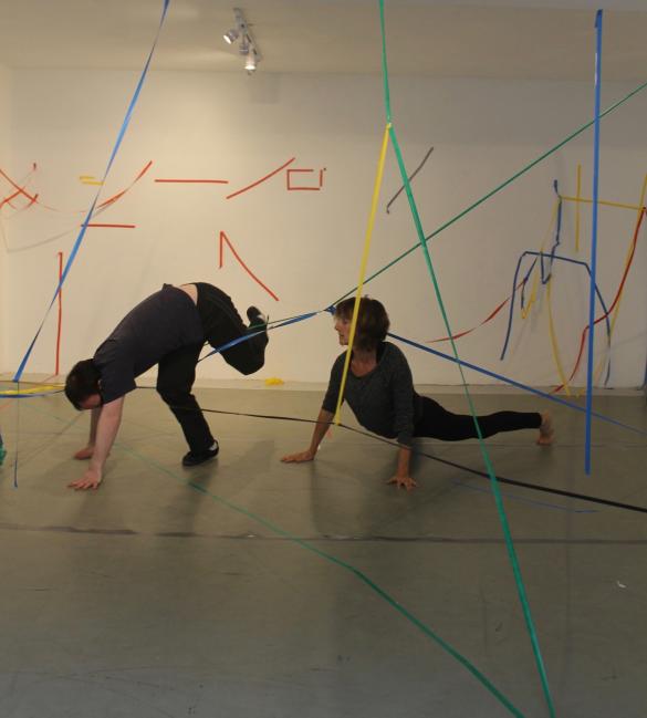 2 people dancing in a space 