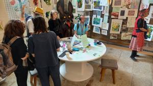 a group of people at an exhibition opening