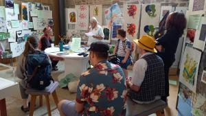a group of people watching a poetry reading at Kresen Kernow
