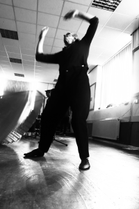 a person dancing with their arms in the air