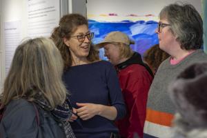 people talking at Rise and Fall exhibition 