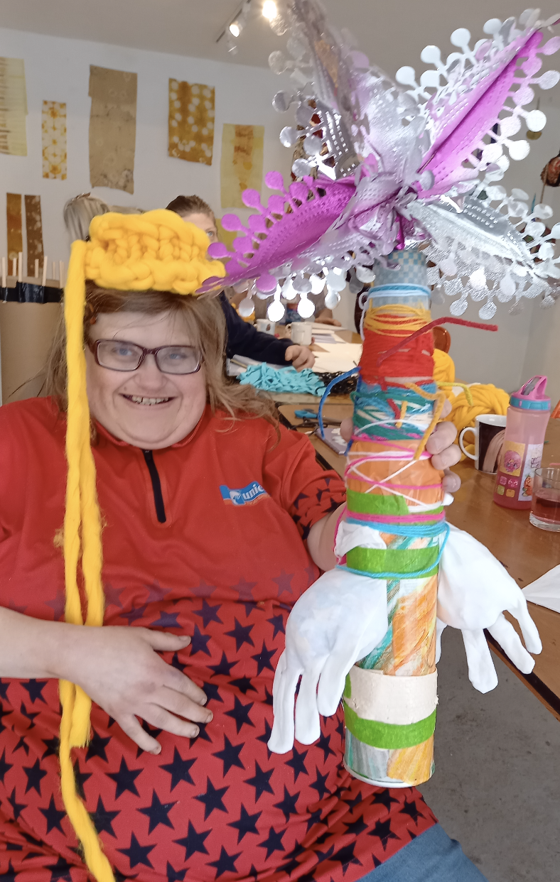 a person with a colourful sclupture