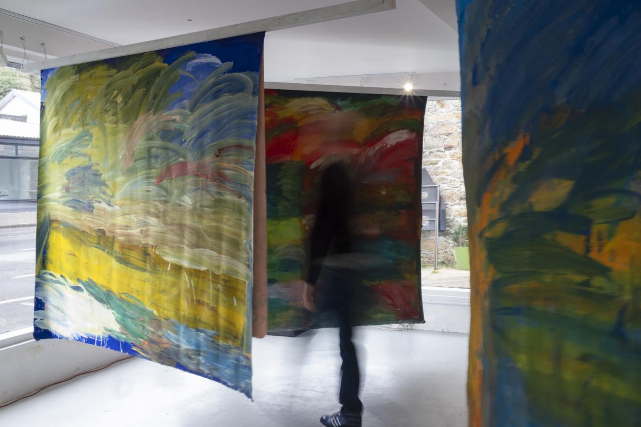 colourful abstract paintings hanging in gallery 