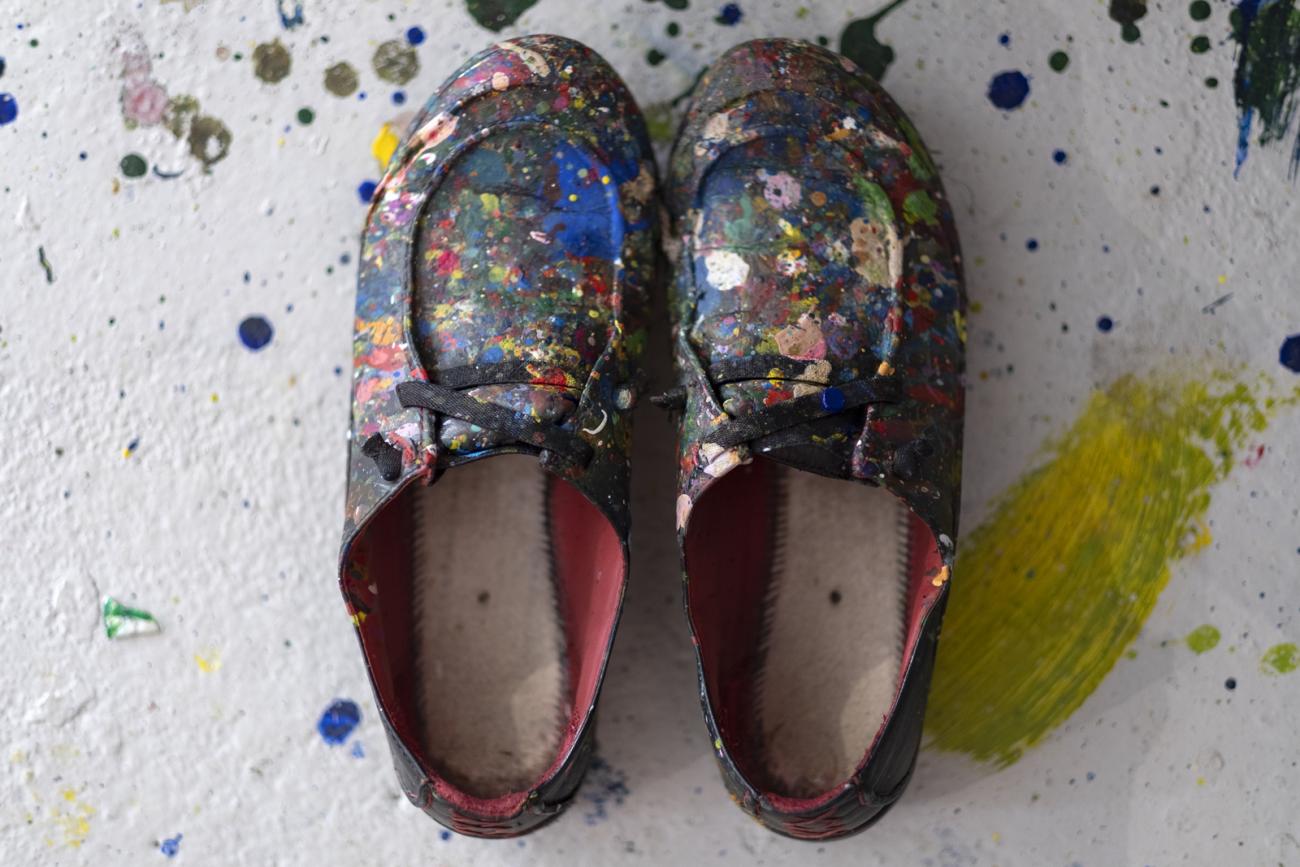 black shoes splattered with paint