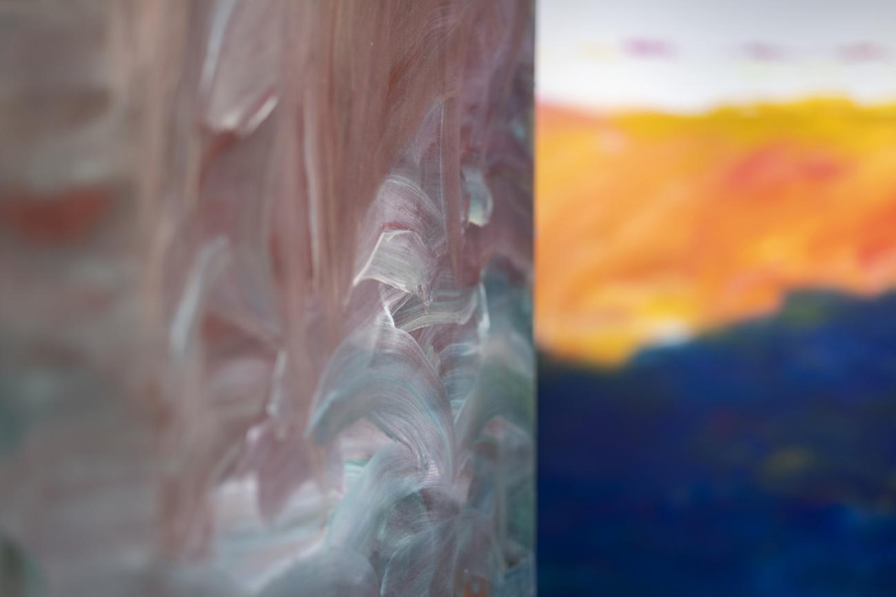 colourful abstract paintings hanging in gallery 