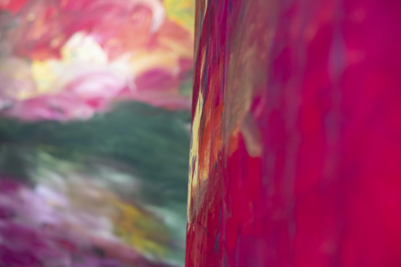 colourful abstract paintings hanging in gallery 