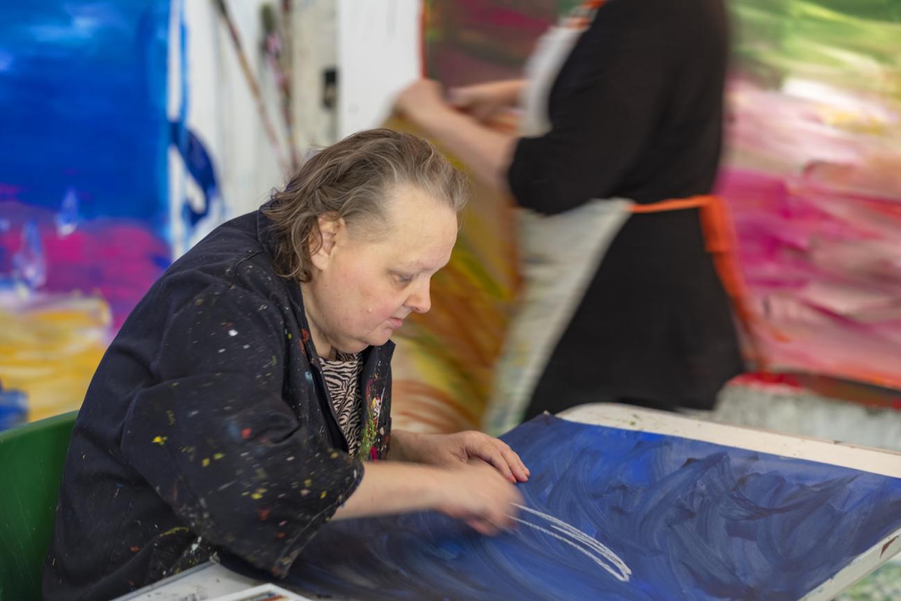 janet holland drawing at a table 