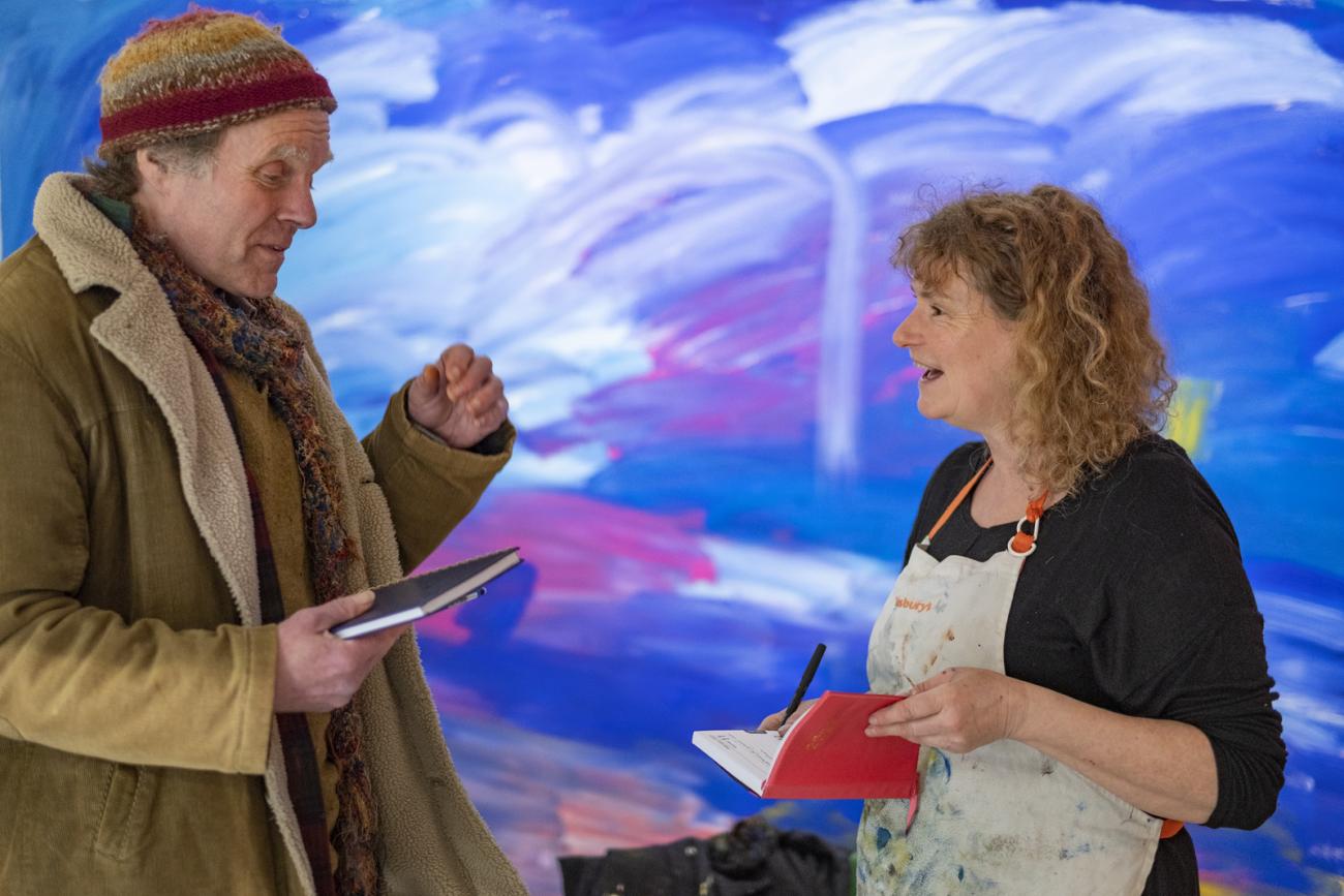 people talking at Rise and Fall exhibition 