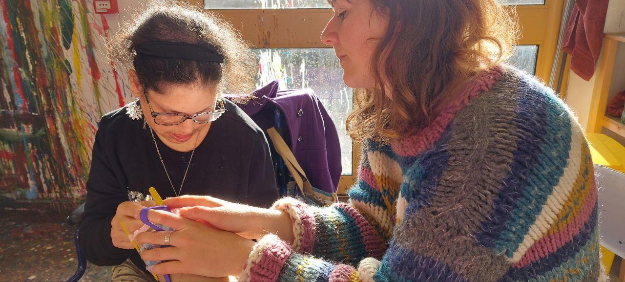 2 people french knitting in the studio